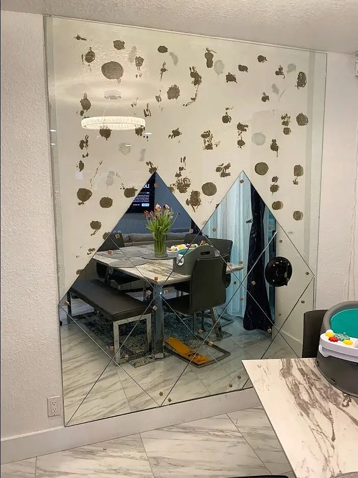 Geometric specialty-mirror wall installation