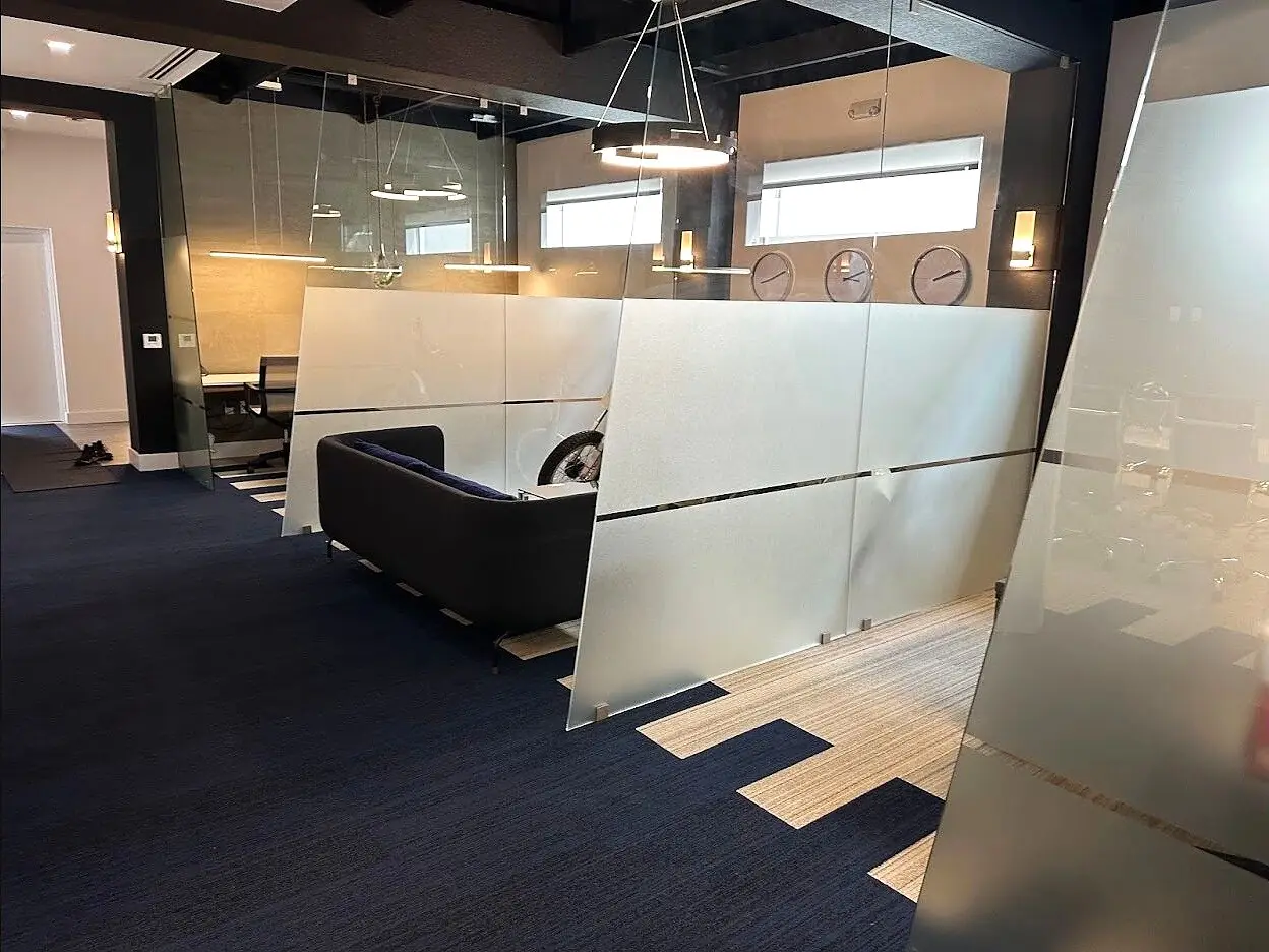Black-framed privacy-glass office partition system