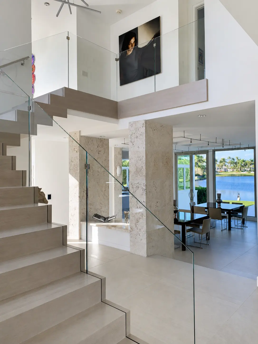 Modern interior staircase with clear glass railing