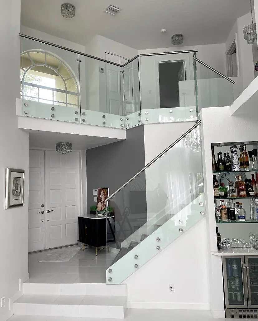 Glass railing in a double-height modern interior